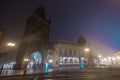 Powder tower and other buildings in late night prague, viewed from adjacent street. Old gothic tower and building Royalty Free Stock Photo