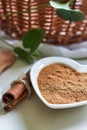 Powdered cinnamon in heart shaped bowl