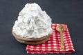 Powdered cream Powder Cream whipped cream in plate on wooden floor. Cooking buttery cream on kitchen