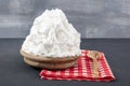 Powdered cream Powder Cream whipped cream in plate on wooden floor. Cooking buttery cream on kitchen