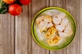 Powdered sliced apple strudel on green plate with fresh apples Royalty Free Stock Photo