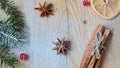 Powdered spices for mulled wine or Christmas bakery orange, anise, cinnamon, fresh red viburnum berries on wooden background Royalty Free Stock Photo