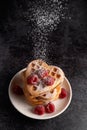 Powdered sugar falling on a stack of waffles Royalty Free Stock Photo