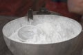 powdered sugar in a metal bowl with a sieve Royalty Free Stock Photo
