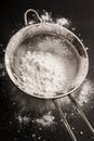 Powdered sugar on a metal sieve and on slate Royalty Free Stock Photo