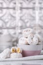 Powdered sugar mini donuts in a kitchen