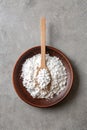 Powdered white sugar with stevia pills in bowl on grey table Royalty Free Stock Photo