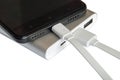 Power bank and black smartphone on white background Royalty Free Stock Photo