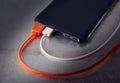 Power bank for charging mobile devices and two USB cables Royalty Free Stock Photo