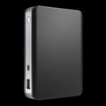 Portable Power Bank for Charging Devices on the Go in Black Plastic Casing Royalty Free Stock Photo