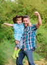 Power being father. Child having fun cowboy dad. Rustic family. Growing cute cowboy. Small helper in garden. Little boy Royalty Free Stock Photo