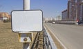 The power button traffic lights at the crosswalk with a blank sign. On an empty sign can be applied to the inscription of any Royalty Free Stock Photo