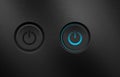 Power buttons on a black metallic background