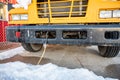 Power cord plugged into a vehicle engine heating block on a bus in a cold climate