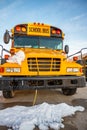 Power cord plugged into a vehicle engine heating block on a bus in a cold climate