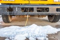 Power cord plugged into a vehicle engine heating block on a bus in a cold climate