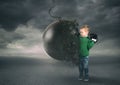 Power and determination of a child against a wrecking ball Royalty Free Stock Photo