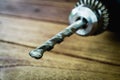 power drill closeup on wooden background Royalty Free Stock Photo