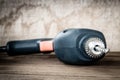power drill closeup on wooden background Royalty Free Stock Photo