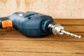 power drill closeup on wooden background Royalty Free Stock Photo