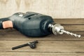 power drill on wooden background Royalty Free Stock Photo