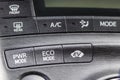 Power , eco and EV mode buttons in hybrid electric car