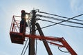 Power electrician lineman at work on pole Royalty Free Stock Photo