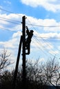 Electrician on electric power pole Royalty Free Stock Photo