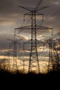 Power - Electricity Pylons and Lines at Sunset Royalty Free Stock Photo