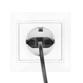 Power European electric plug isolated on a white. black electric cord plugged into a white electricity socket on white background Royalty Free Stock Photo