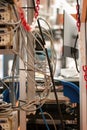 Power extension cord with multiple sockets, multiple power cords plugged in, inside a lab. Close up shot, shallow depth of field,