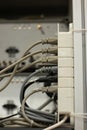 Power extension cord with multiple sockets, multiple power cords plugged in, inside a lab. Close up shot, shallow depth of field,