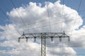 Power generation, transmission and distribution concept. Close-up of a electricity supply pylon and the high voltage power lines Royalty Free Stock Photo