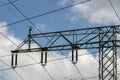 Power generation, transmission and distribution concept. Close-up of a electricity supply pylon and the high voltage power lines Royalty Free Stock Photo