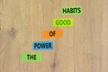 The power of good habits symbol. Concept words The power of good habits on colored paper. Beautiful wooden table wooden background Royalty Free Stock Photo