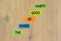 The power of good habits symbol. Concept words The power of good habits on colored paper. Beautiful wooden table wooden background Royalty Free Stock Photo