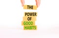 The power of good habits symbol. Concept words The power of good habits on wooden block. Beautiful white table white background. Royalty Free Stock Photo