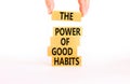 The power of good habits symbol. Concept words The power of good habits on wooden block. Beautiful white table white background. Royalty Free Stock Photo