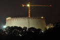 Power lights illuminated at night. Chimneys launching smoke. Cranes, extending the electron. Heat generation. Royalty Free Stock Photo