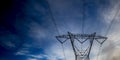 Power line against a dramatic cloudy sky Royalty Free Stock Photo