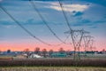 Power line in cultivated fields Royalty Free Stock Photo