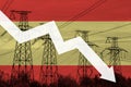 Power line and flag of Spain. Energy crisis. Concept of global energy crisis. Decreased electricity generation. Graph arrow is