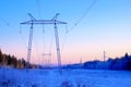 Power line in the forest in winter Royalty Free Stock Photo