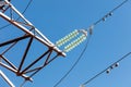 A power line with a green and white insulator Royalty Free Stock Photo