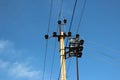 Power line insulators against blue sky background Royalty Free Stock Photo