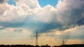 Power line masts against a stormy sky Royalty Free Stock Photo