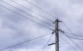 A power line pole with electrical wires isolated against the sky. Power line, power supply Royalty Free Stock Photo