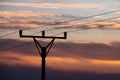 Power line pole silhouette detail with sunset sky Royalty Free Stock Photo