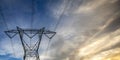 Power line silhouetted against a cloudy sky Royalty Free Stock Photo