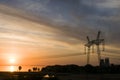 Power line support against the background of a red sunset on the Royalty Free Stock Photo